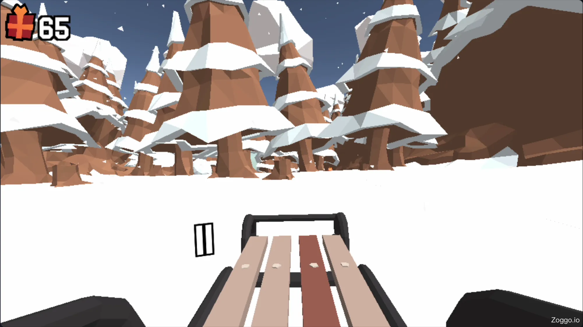 Gameplay of Snow Rider 3D showing a sled dodging trees and collecting gift boxes at high speed